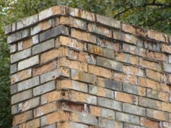 Close detail of finished brickwork on a rebuilt chimney