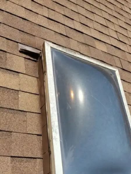 Skylight detail on a shingle roof, a common source of leaks