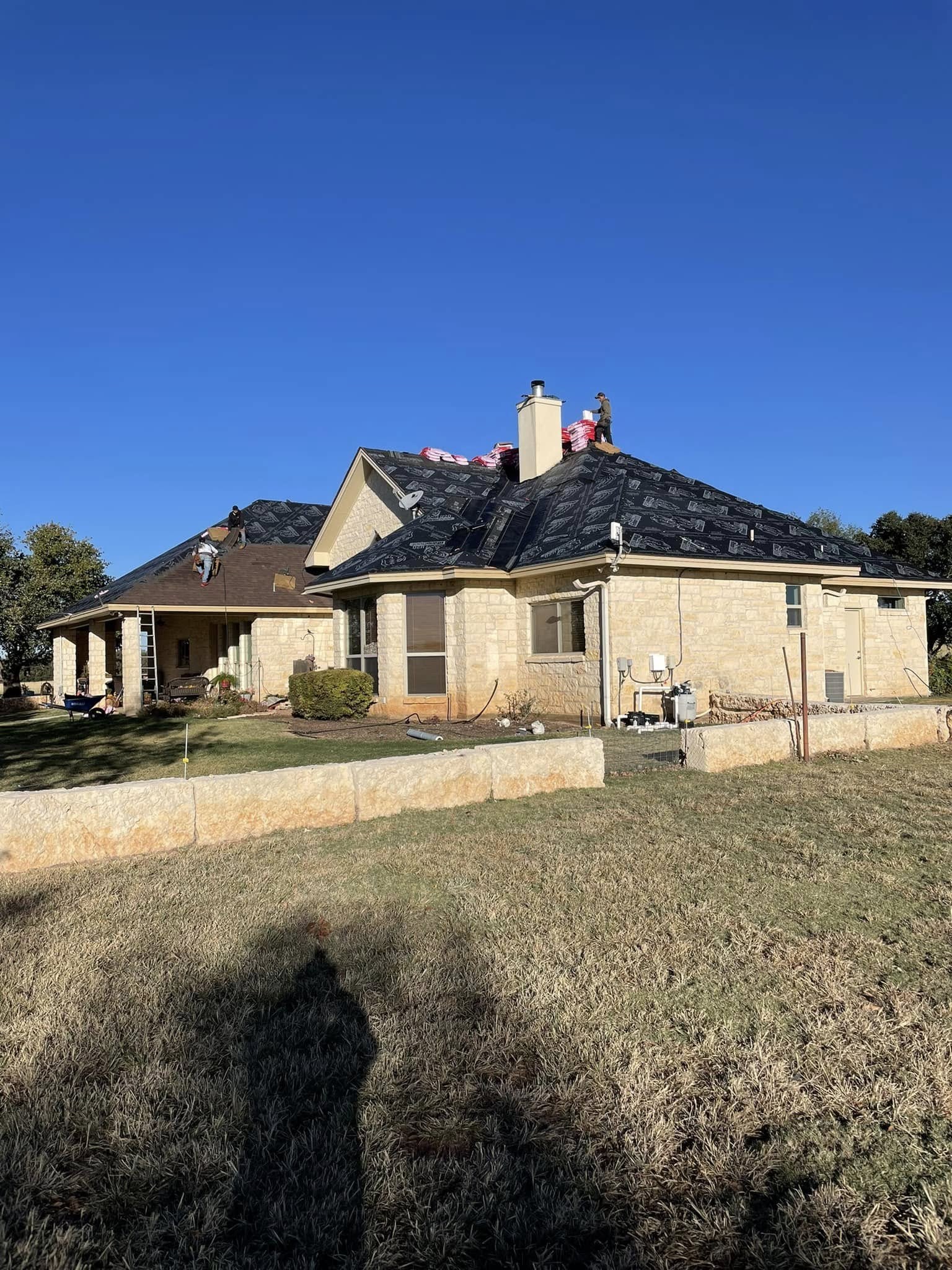 Wide view of a home after a completed roof replacement